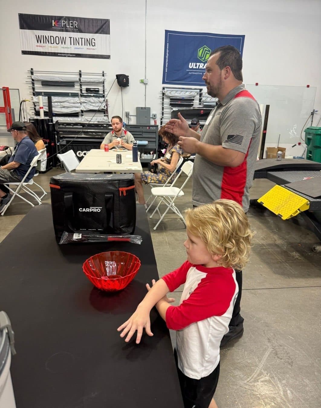 Chais, owner of Polished to Perfection, with his son Asher at the shop