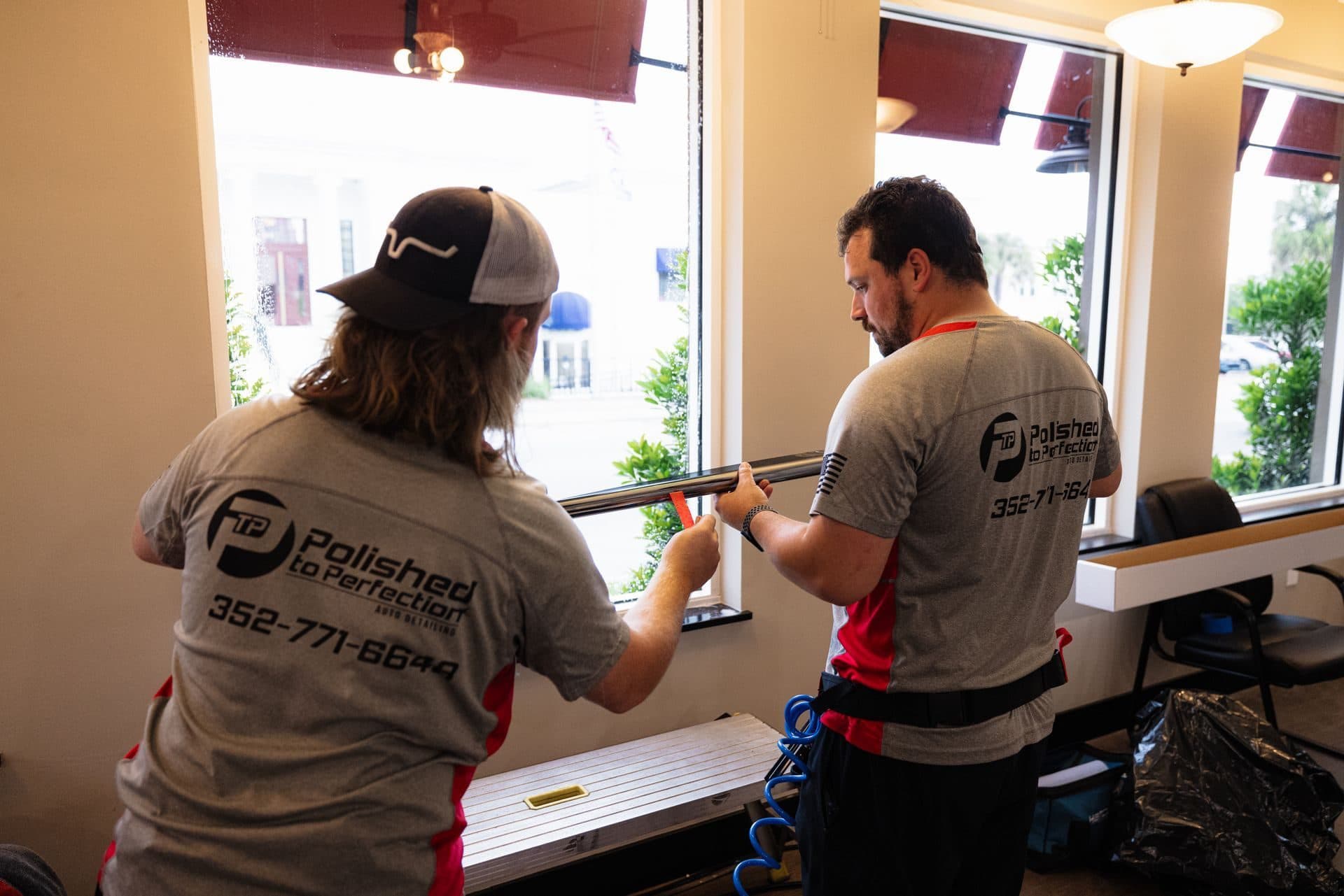 Crew installing window film